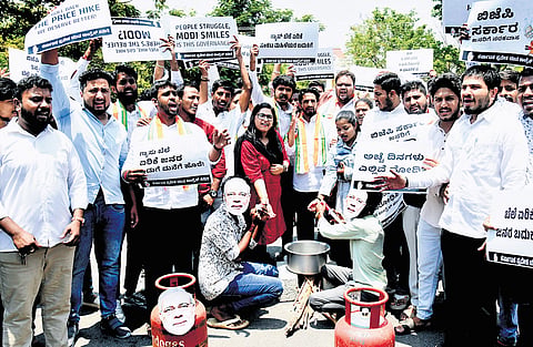 Youth Congress members protest against the Union Government for hiking the prices of petrol, diesel and cooking gas, in Mysuru on Thursday 