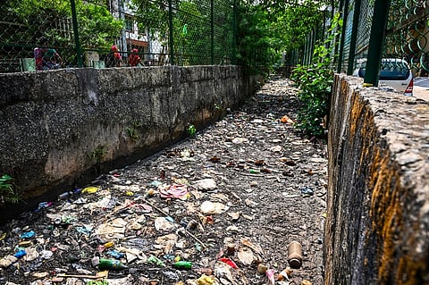 Wastes accumulated in drainage channel 