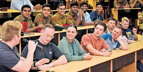 United States Navy’s P-8A Poseidon maritime patrol aircraft crew members interacting with students at VIT 
