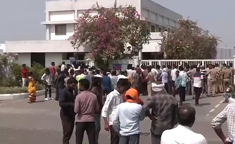 People outside the MMP factory where five people died in fire incident.