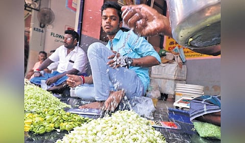 Vendors selling jasmine at Madurai flower  market on Sunday 