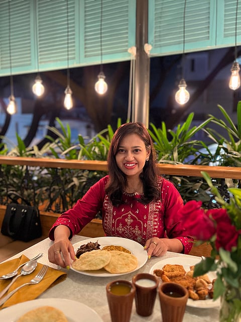Debolina Ray with a Bengali platter, replete with luchis and other delicacies 