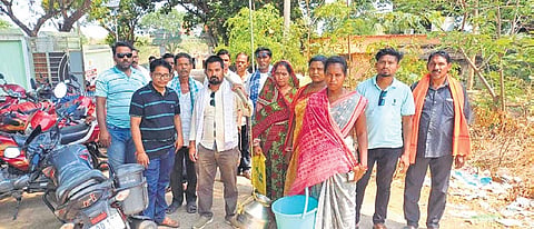 Villagers protesting with empty buckets against water scarcity 