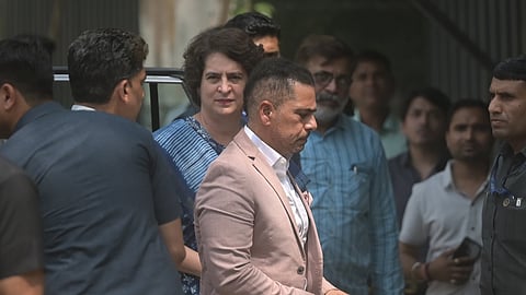 Robert Vadra with wife and Congress leader Priyanka Gandhi Vadra ahead of his appearance before the Enforcement Directorate on the third straight day.