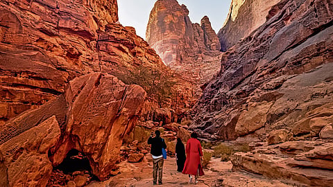 Tourits at the sandstone cliffs of Jabal Ikmah