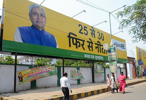 A hoarding features Bihar Chief Minister Nitish Kumar saying '25 Se 30, Fir Se Nitish' ahead of State Legislative Elections outside Janata Dal (United) office, in Patna on Thursday. 