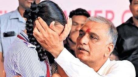 Former minister and BRS MLA T Harish Rao gets emotional as a young girl shares her story of grief during a programme in Siddipet on Saturday