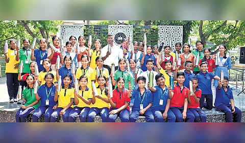 Students of Government high school at IRC village in Bhubaneswar strike a pose with their steel sippers 