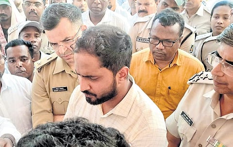 Police officials holding talks with the agitators at Barkani on Sunday 