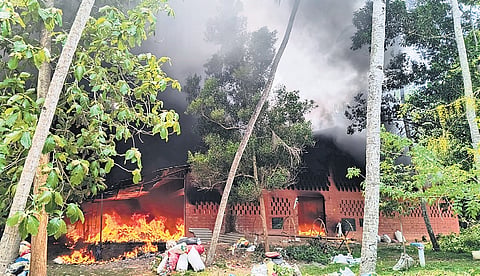 The building at Kattadimukku near Azhoor in Thiruvananthapuram engulfed in flames on Tuesday.