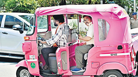 A man driving a pink auto with a passenger at the secretariat in Chennai on Thursday 