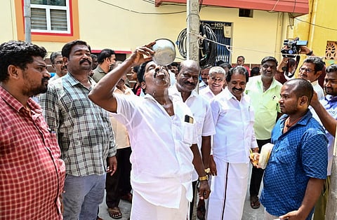 Ward 10 councillor R Muthukumar on Wednesday consuming water supplied by the corporation in front of residents to prove its safety 
