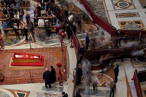 People pay their respects to the late Pope Francis at the Vatican
