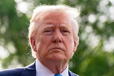 President Donald Trump speaks with reporters as he and first lady Melania Trump depart on Marine One from the South Lawn of the White House, Friday, April 25, 2025, in Washington. 