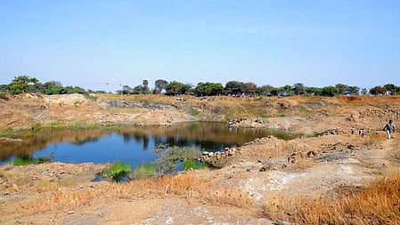 An abandoned open stone quarry in Velampalayam in Tiruppur district.