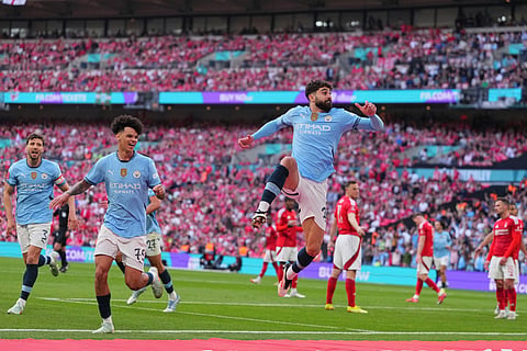 Manchester City's Josko Gvardiol, right, celebrates after scoring during the English FA Cup semifinal soccer match between Nottingham Forest and Manchester City at Wembley stadium in London, Sunday, April 27, 2025.