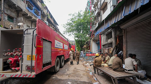 Police personnel outside the Rituraj hotel a day after a fire broke out here, at Mechua in Kolkata, Wednesday, April 30, 2025. 