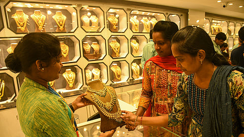 Customers looking at jewellery pieces at a store 