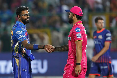 Mumbai Indians' captain Hardik Pandya shakes hand with Rajasthan Royals' Riyan Parag after Mumbai Indians wins against Rajasthan Royals during the Indian Premier League cricket match at Sawai Mansingh Stadium in Jaipur, India, Friday, May 2, 2025.