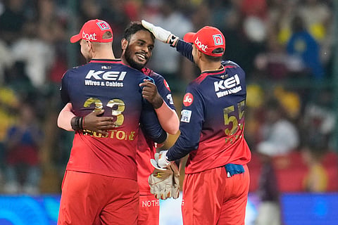 Royal Challengers Bengaluru's Yash Dayal, center, celebrates with teammates after their win in the Indian Premier League cricket match against Chennai Super Kings at Chinnaswamy Stadium in Bengaluru, India, Saturday, May 3, 2025. 