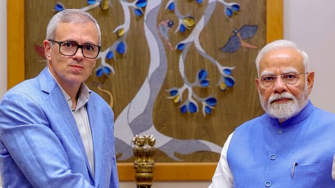 Prime Minister Narendra Modi with Jammu and Kashmir Chief Minister Omar Abdullah during a meeting, in New Delhi. 