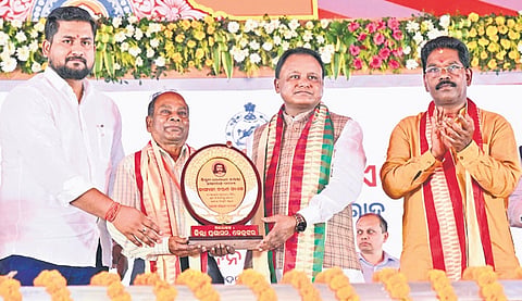 CM Majhi felicitating Kangali Charan Naik with Dharanidhar award 