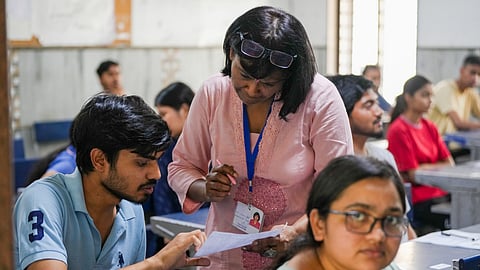 Candidates at an examination center appearing for the National Eligibility-cum-Entrance Test (NEET) UG-2025, at Vinod Nagar area, in New Delhi, Sunday, May 4, 2025.