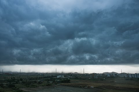 Dark clouds over Vijayawada on Sunday. 