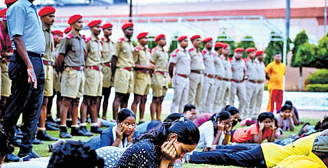 Civil Defence volunteers and fire services personnel conduct a demonstration ahead of Wednesday’s mock drill at the Fire Station ground, in Bhubaneswar on Tuesday | 