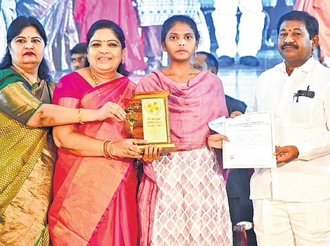 Social Welfare Minister Dr. Dola Sri Bala Veeranjaneya Swamy along with Tribal Welfare, Women & Child Welfare Minister Gummidi Sandhyarani, presented awards to the top performers from Social Welfare, Tribal Welfare residential schools, and hostels for excelling in Class 10 and Intermediate exams at an awards ceremony at Tummalapalli Kalakshetram in Vijayawada on Wednesday. 