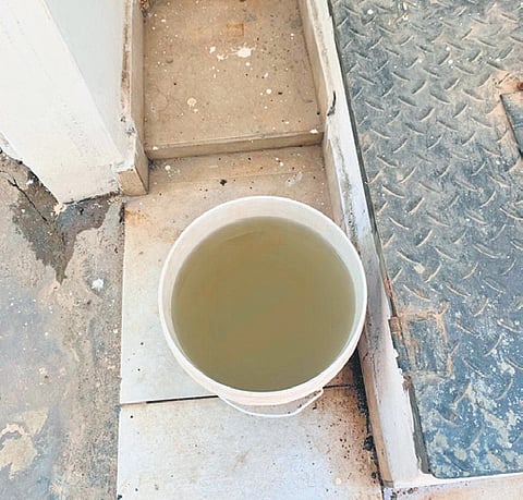 A bucket of tap water collected by a resident in Shanthi Nagar