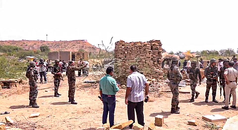 Jaisalmer: Police and army personnel stand near the spot where an unidentified object was found in Kishanghat area of Jaisalmer, Rajasthan, Friday, May 9, 2025. 