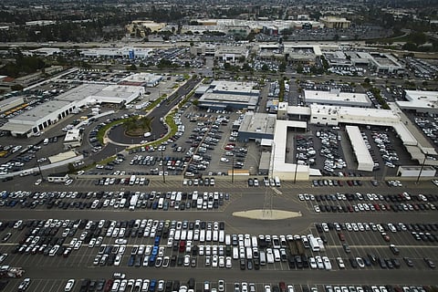 An aerial view shows auto dealerships in Cerritos, Calif., Thursday, March 27, 2025. 