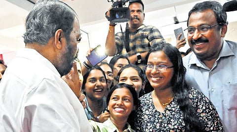 General Education Minister V Sivankutty joins the students of Govt HSS for Girls, Cotton Hill, Thiruvananthapuram, as they celebrate their success in SSLC exams on Friday. Director of General Education Shanavas S is also seen 