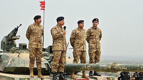 Pakistan's Army Chief General Syed Asim Munir (2L) stands on a military tank while speaking with army troops to witness exercise 'Hammer Strike', a high-intensity field training exercise conducted by Pakistan Army’s Mangla Strike Corps at the Tilla Field Firing Ranges (TFFR) in Jhelum, Punjab province, May 1, 2025. 
