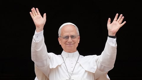 Pope Leo XIV appears at the central balcony of St. Peter's Basilica for his first Sunday blessing after his election, in St. Peter's Square at the Vatican, Sunday, May 11, 2025
