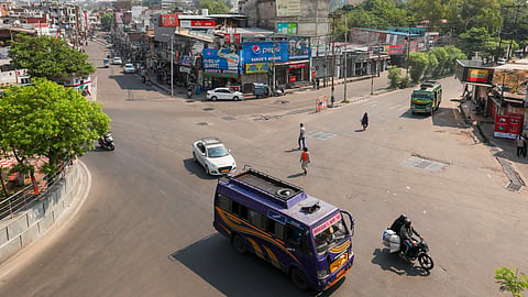 People commute as normal activities resume, a day after India and Pakistan reached a bilateral understanding, in Jammu.