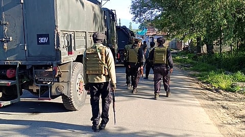 Security personnel undertake a cordon and search operation after getting specific input about the presence of terrorists, at Nader Tral area of Awantipora, in Pulwama on May 15, 2025. 