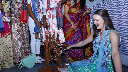 A contestant tries her hand at a charkha in Pochampally on Thursday