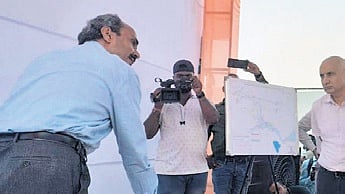File photo of officials discussing the plan to acquire land at Badatubi in 2023 