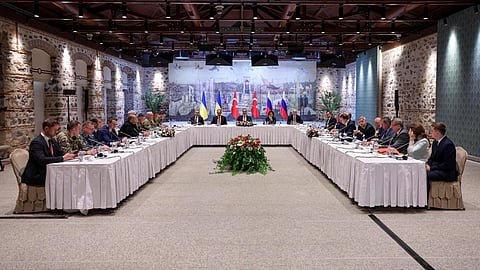 Turkish Foreign Minister Hakan Fidan, centre, chairs a meeting between delegations from Russia, right, and Ukraine, left, at Dolmabahce Palace in Istanbul, Turkey, Friday, May 16, 2025. 