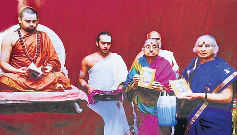 Srungeri seer sri Bharati teertha swamy releasing book penned by satyaveni sisters