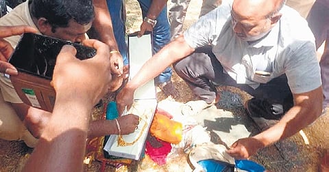 The gold recovered from the well was handed over to the police 