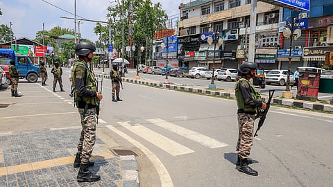 Army personnel stand guard following the ceasefire between India and Pakistan, in Srinagar on Sunday
