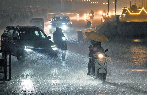 Commuters caught in heavy rain in Hyderabad on Wednesday. Bandlaguda in the city received 88.8 mm, Amberpet 85 and Saidabad 83.8 mm 