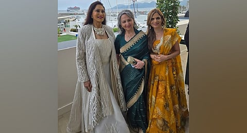 Sharmila Tagore captivated audiences at the 2025 Cannes Film Festival, gracing the red carpet in a regal emerald green silk saree adorned with a gold zari border.