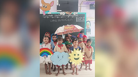 Kids with the craft works of sun, clouds and rainbows at the  Anganwadi centre in Virudhunagar.