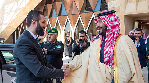 In this photo provided by the Saudi Ministry of Media, Saudi Crown Prince Mohammed bin Salman, right, greets Syria's interim President Ahmad al-Sharaa during his arrival at the royal palace in Riyadh, Saudi Arabia, Feb. 2, 2025. 
