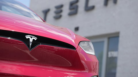 A model X sports-utility vehicle sits outside a Tesla store in Littleton, Colo., June 18, 2023.