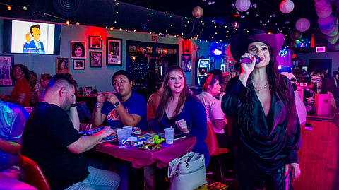 Audrey Campos speaks during a Loteria game night at Jackie O's Cocktail Club in Fort Worth, Texas, Tuesday, May 27, 2025.